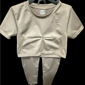 Chocolate brown Two-Piece Set crop top with high waisted leggings.